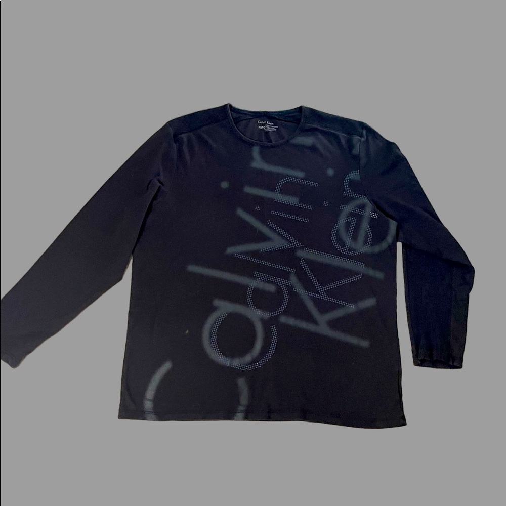 Black long sleeve Calvin Klein shirt.